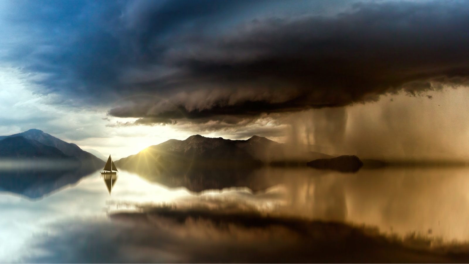 A small sailing boat on calm water beneath a storm